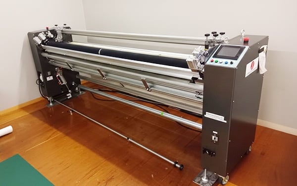 写真：検尺自動裁断機リミットカッター